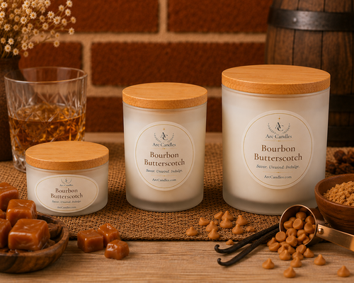 Three Arc Candles scented soy wax candles in frosted glass jars with light wood lids are arranged on a burlap runner with caramel, vanilla beans, and a whiskey glass in a rustic setting. Hand poured in Virginia.