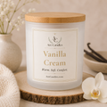 A frosted glass jar candle with a light wood lid sits on a rustic wood slice coaster. The front label reads 'Arc Candles' and 'Vanilla Cream' with 'Warm.